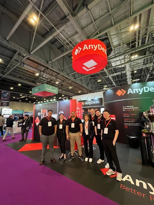 AnyDesk team at trade show in branded apparel