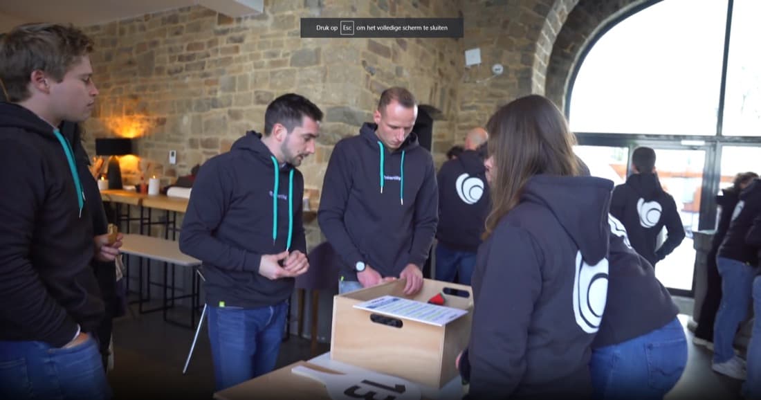 Baker Tilly team unpacking branded hoodies at the venue