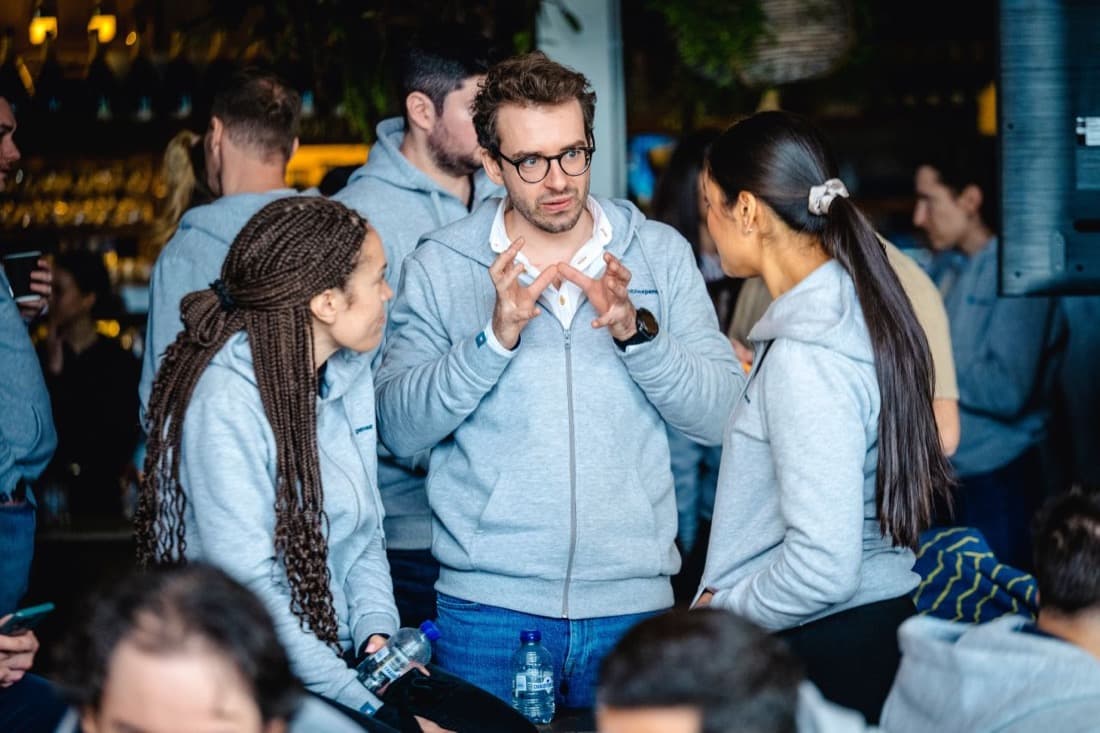 MobilExpense team in matching grey hoodies at their SKO