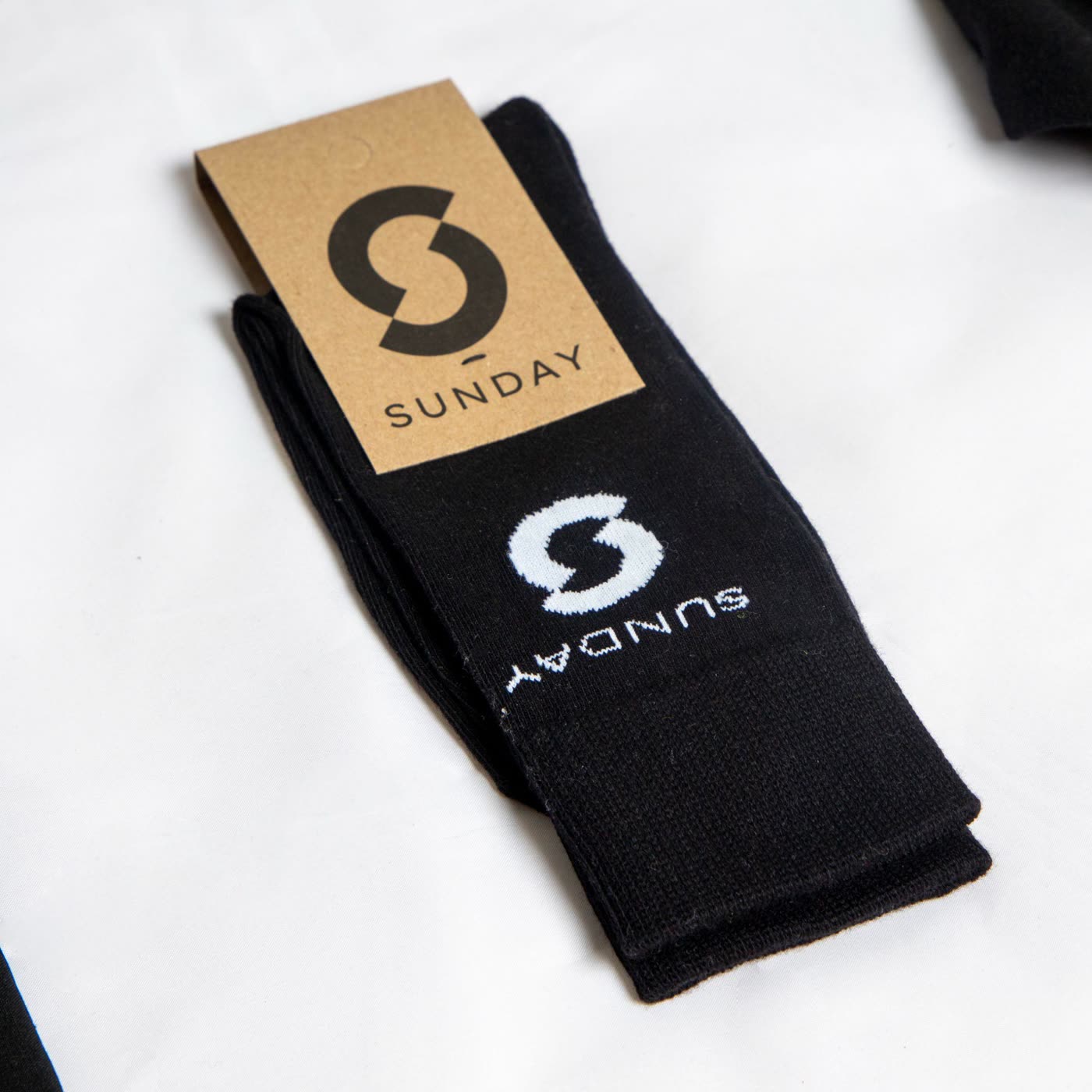 Branded Sunday crew socks with kraft packaging