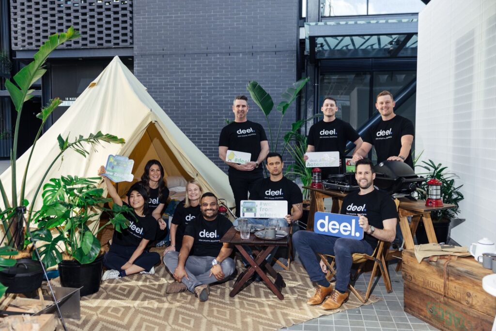 Deel team wearing branded merchandise at an event